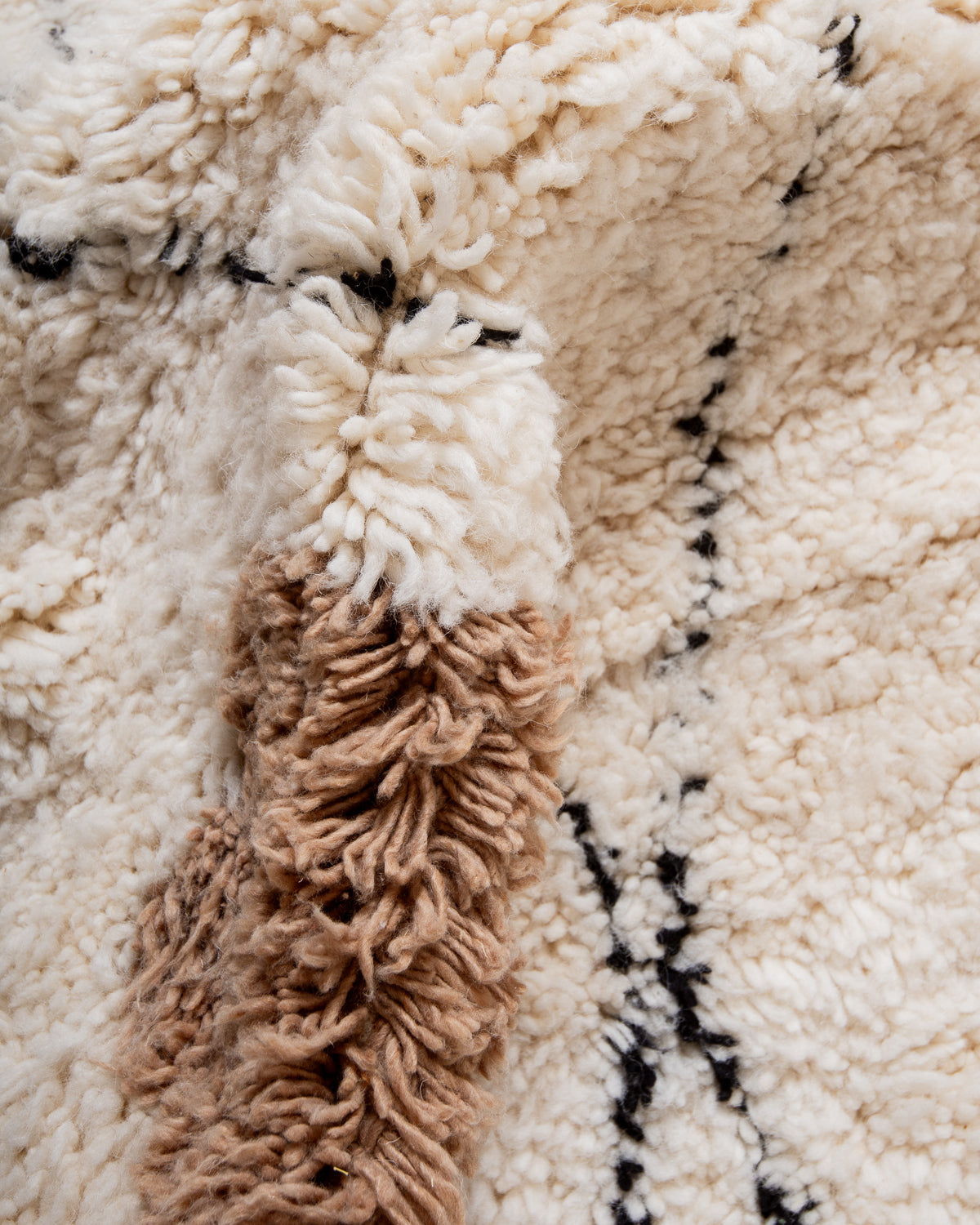 Modern, designer, handcrafted Berber rug from Morocco. Beniourain carpet with beautiful colours and patterns and fluffy wool texture.